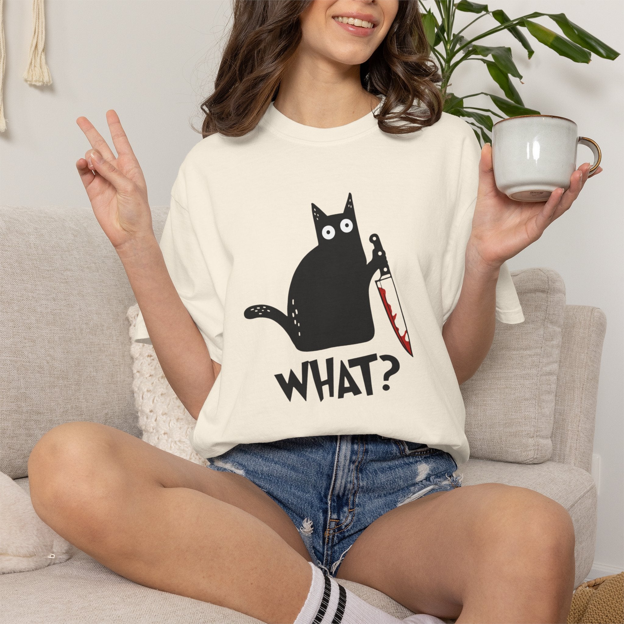 Funny Cat Holding Knife T-Shirt — "What?" Graphic Tee (Dark Humor, Halloween Gift)